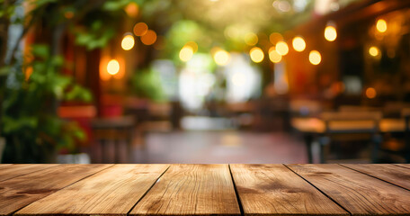 Fototapete - Brown wooden rough countertop table with blurred caffe bar pub background with lights and cozy room, evening restaurant blurred background and old brown wooden table with empty copy space. tabletop