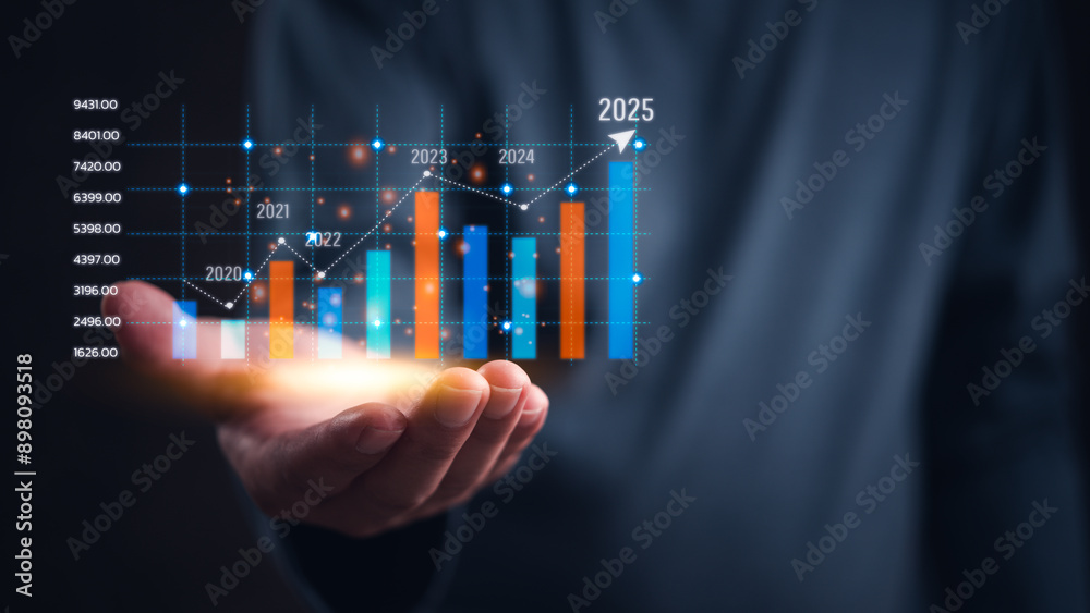 Hand holding a glowing bar chart projecting growth up to 2025 ...