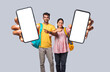 © StockImageFactory - Asian Indian two college students holding big blank smartphone