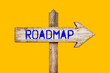 © Rysak - Wooden signpost with roadmap arrow