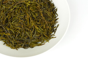 Poster - Close-up and top angle view of stacked wet raw seaweed of hizikia fusiforme on white dish, South Korea
