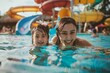 © ChaoticMind - A delighted mother and her young daughter are happily enjoying their swimming time together in a colorful water park, sharing joyful moments and laughter in the pool.