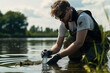 © Damian - Scientist collecting water samples