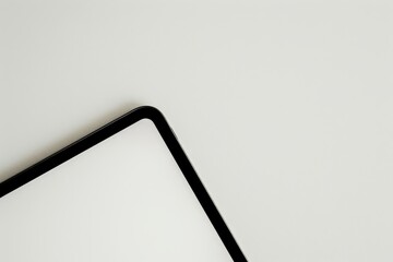 Aufkleber - This image shows a close-up view of the corner of a sleek, minimalist-designed tablet against a plain background, highlighting its smooth edges and modern aesthetics.