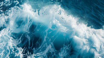 Powerful blue breaking ocean waves with white foam