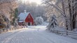© Kanin - Charming red barn in a winter wonderland. Snow-covered landscape and trees create a serene, picturesque scene on a rural farm.