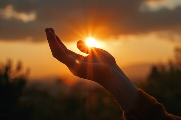 Wall Mural - Hand holding sun amidst clouds