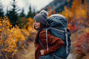 Poster - Female backpacker trekking alone through mountains