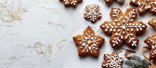 Fototapete - Top view of Christmas gingerbread snowflake cake cookies and biscuits for decorations in a flat lay arrangement with copy space image