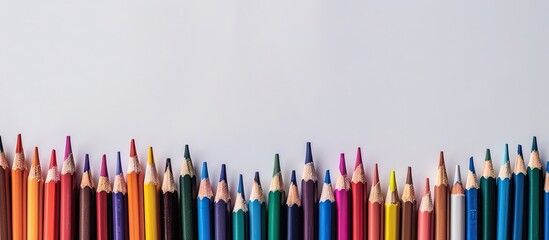 Aufkleber - Colorful pencils and school supplies arranged in a frame on a white background with room for text or images. Creative banner. Copyspace image