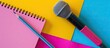 © HN Works - Arrange a pencil on a notepad and a microphone against a colorful background to create a captivating composition with copy space image