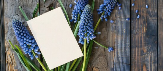 Aufkleber - Top down view of a mockup displaying a spring themed greeting card with blue muscari flowers perfect for adding text or images. Creative banner. Copyspace image