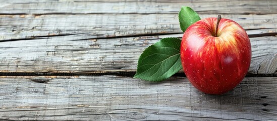 Poster - Apple placed on weathered wooden surface with copy space image available