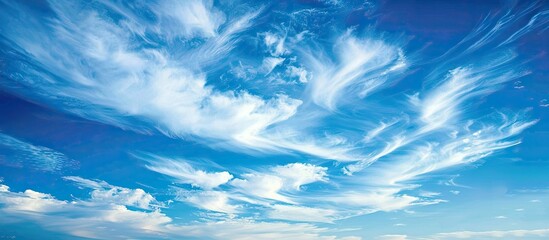 Aufkleber - Beautiful cirrus clouds against a blue sky at sunset provide a stunning copy space image