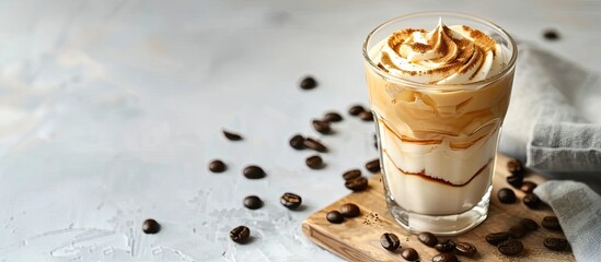 Aufkleber - Close up of Dalgona coffee in a glass on a cutting board a trendy cold drink on a light background offering copy space image for text in a flat lay style