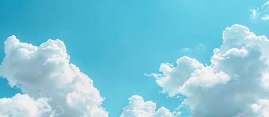 Poster - Blue sky with white clouds framing a serene copy space image for your design needs