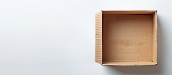 Poster - A cardboard box on a white background ideal for design presentations with copy space image
