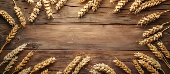 Poster - Barley and wheat ears placed on a wooden desk frame the copy space image leaving room for your text in the center