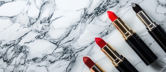 Poster - Cosmetic items such as lipsticks displayed on a marble backdrop with copy space image