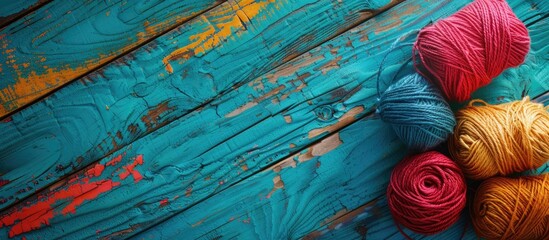 Poster - Colorful threads used for decoration on a vibrant wooden backdrop perfect for a copy space image