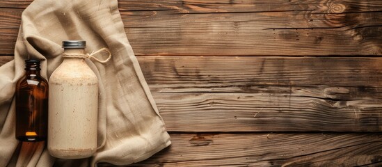 Poster - Top down view of a hot water bottle displayed on a wooden surface with ample copy space image