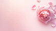 © tl6781 - delicate pink rose with a few scattered petals on a soft pink background. The image conveys a sense of elegance, beauty, and romance