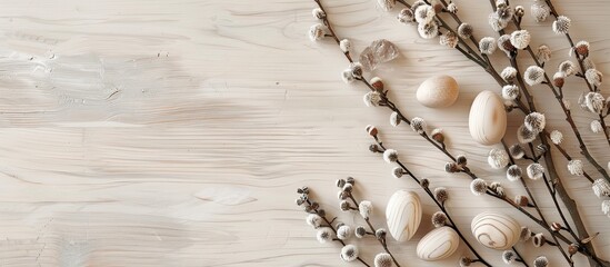 Poster - Bright wooden table decorated with white wooden Easter eggs willow catkin and with space for an image. Creative banner. Copyspace image