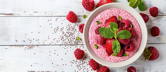 Poster - Chia dessert served in a bowl on a white wooden table with copy space image