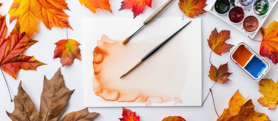 Aufkleber - Autumn themed artist s workspace with a sheet of paper watercolor paint set brush and autumn leaves arranged for a top view copy space image