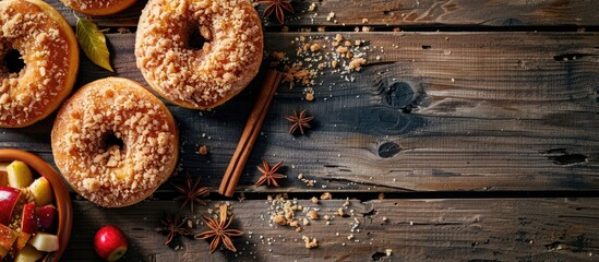 Aufkleber - Delicious homemade apple cinnamon donuts with apple pie crumble and spices placed on a wooden table with a copy space image