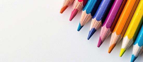 Wall Mural - Colorful pencils on white backdrop with room for text ideal for educational themes or back to school concepts. Creative banner. Copyspace image