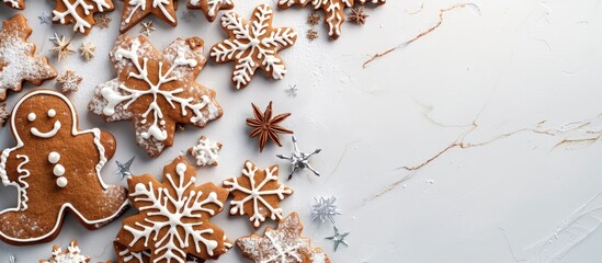 Poster - Top view of Christmas gingerbread snowflake cake cookies and biscuits for decorations in a flat lay arrangement with copy space image