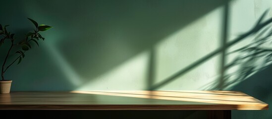 Fototapete - A desk with ample blank space to showcase your product set against a wall casting shadows ideal for a copy space image