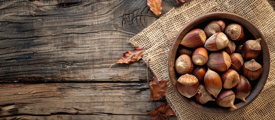 Aufkleber - Chestnuts displayed on a rustic wooden table with a burlap napkin presenting a quaint setting for a copy space image