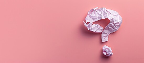 Poster - Top view of a crumpled paper with a question mark on a pink background providing copy space for text or images