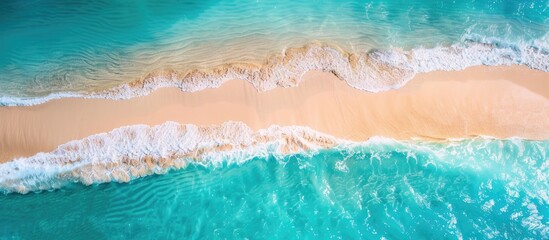 Poster - A beautiful sandy beach with turquoise water seen from a drone offers a copy space image