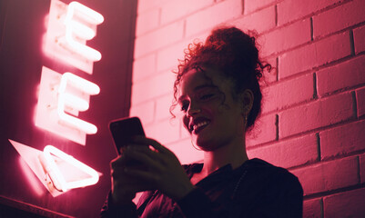 Aufkleber - Wall, neon lights and woman with smartphone, night and smile with connection, typing and internet. Person, mobile user and girl with cellphone, evening and social media with texting, city and message