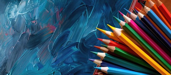 Poster - Back to school theme with school accessories like pencils on a pile of books set against a brush background with a copy space image for school related websites or articles