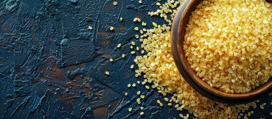 Aufkleber - Top view of crushed raw bulgur grain on a food background with copy space image perfect for a menu concept focused on organic healthy eating suitable for keto or paleo diets