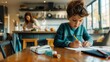 © ibooM - A boy with a school backpack sits at the kitchen table doing his homework, while his mother prepares dinner.