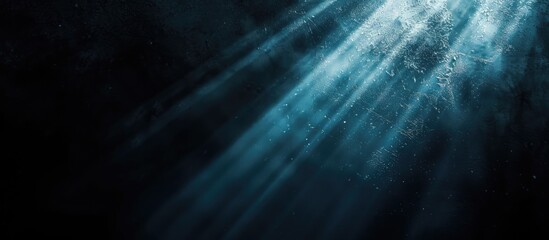 Aufkleber - Dark backdrop featuring a focused beam of light contrasted with a lack of visual elements creating a copy space image