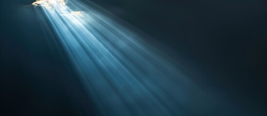 Aufkleber - Dark backdrop featuring a focused beam of light contrasted with a lack of visual elements creating a copy space image