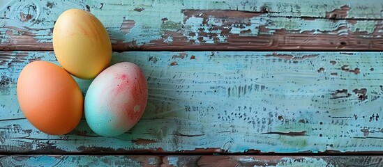 Fototapete - Colorful vintage eggs displayed on a wooden table background suitable for copy space images