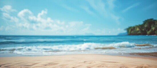 Poster - Blurred beach with sunlight and blue sky suitable as a copy space image for summer vacation and business travel ideas