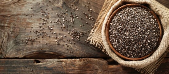 Aufkleber - Chia seeds in a bowl on a wooden surface with copy space image