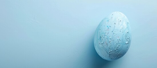 Fototapete - Top down view of a blue painted Easter egg frame providing room for text on a flat surface. Creative banner. Copyspace image