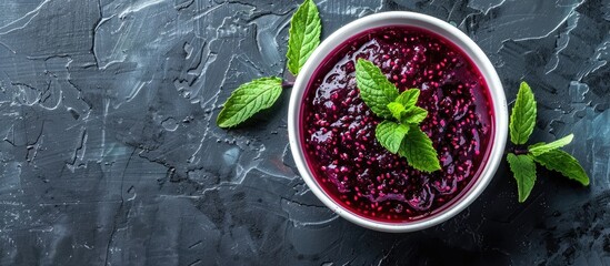 Aufkleber - Bowl containing mulberry jam topped with mint leaves with copy space image