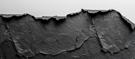Aufkleber - Black paper with torn and ripped edges set against a white background featuring copy space image