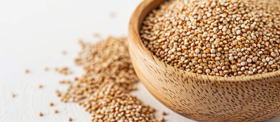 Aufkleber - Chenopodium quinoa grains in a bowl with a white background suitable for use as a copy space image