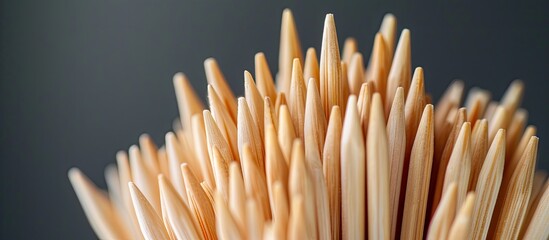 Aufkleber - Close up macro shot of sharp toothpicks arranged uniquely against a grey backdrop with ample copy space image